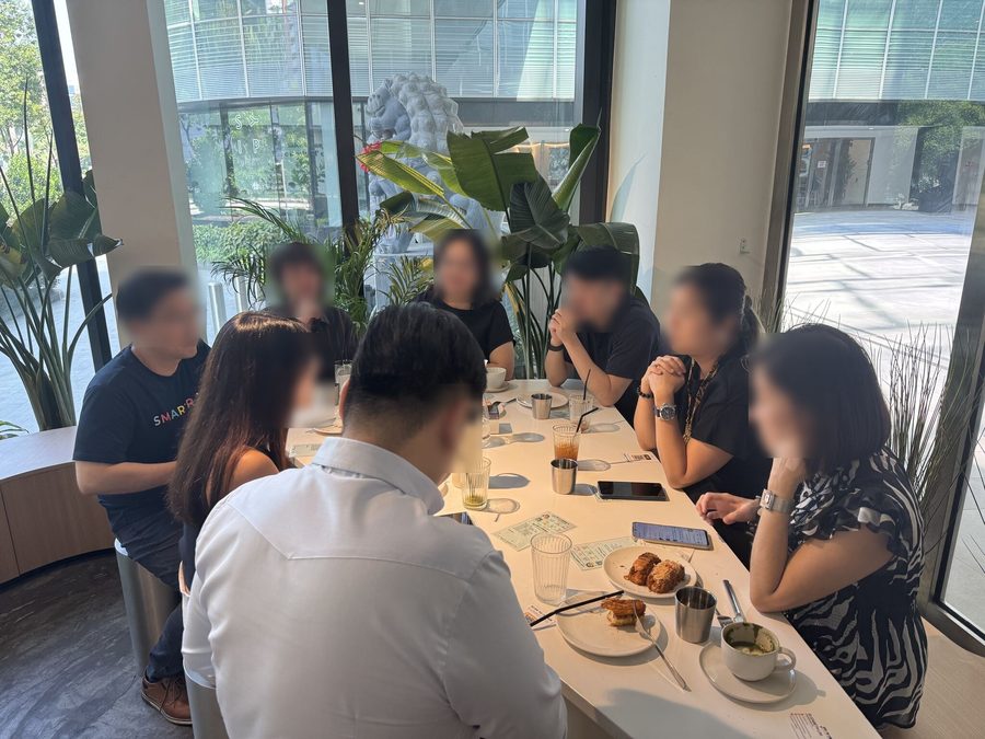 A group meeting around a table at Bendemeer