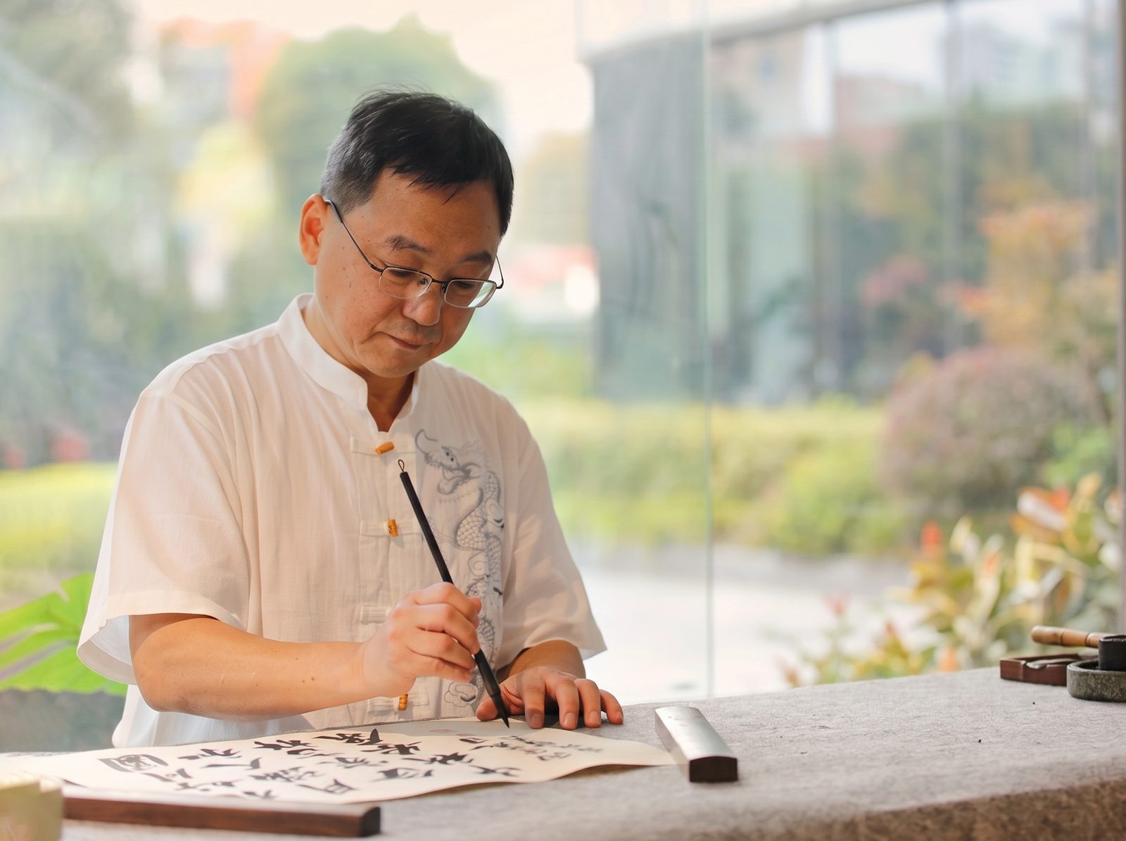 Calligrapher demonstrating brush strokes