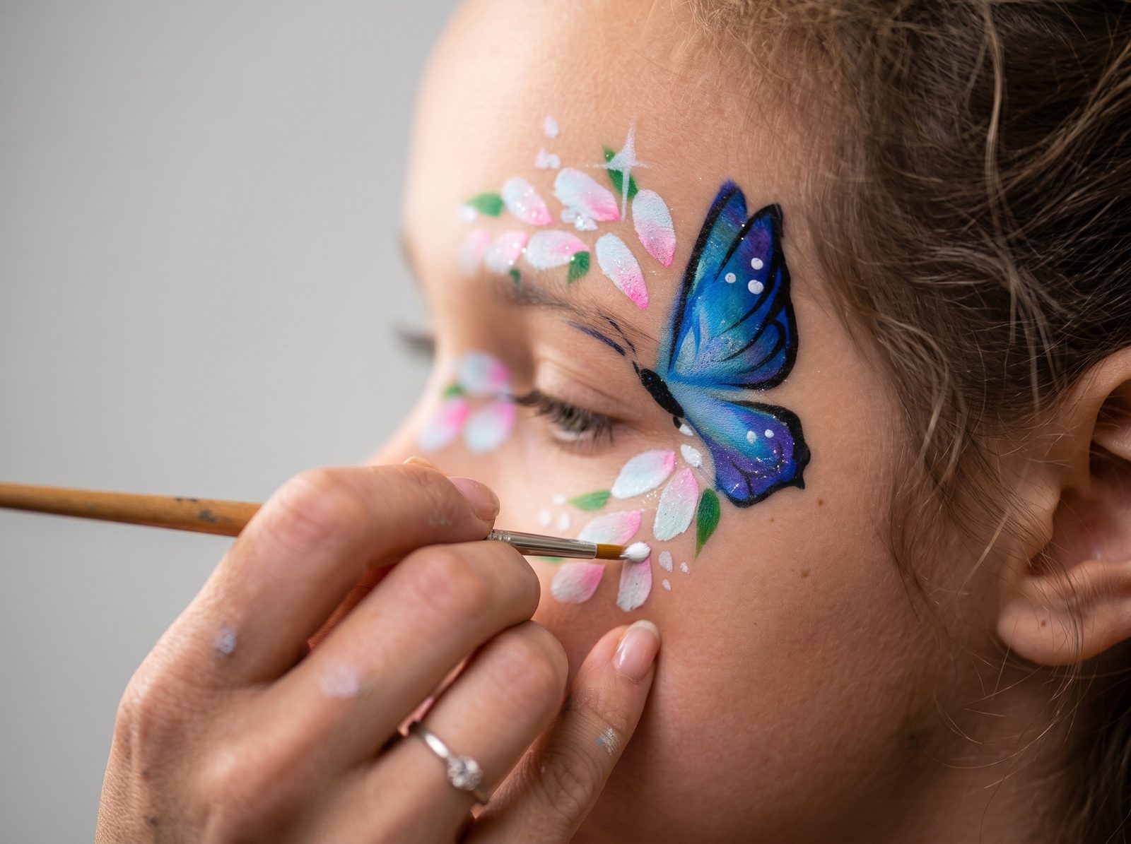 Child enjoying complimentary face or hand painting